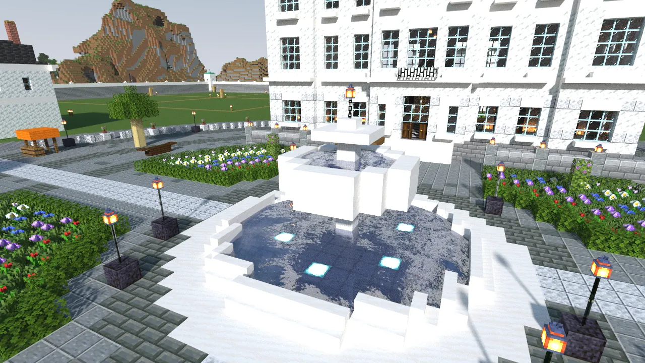 The square and its fountain, in front of the town hall.