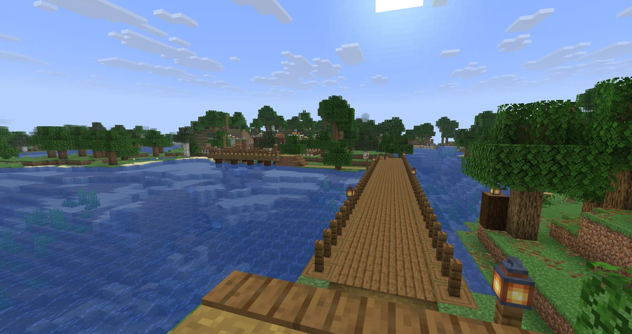 A wooden jetty running out over a lake in the Diggings, near the outpost.